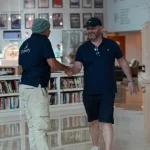 Trawey Tours guide greeting an international traveler during a Dubai layover airport pickup and transfer service.